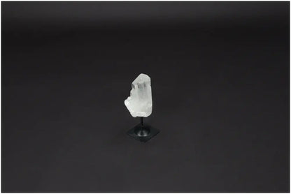 Lemurian Quartz crystal on a metal stand, known as the "Master Healer," amplifying energy and intentions for clarity and balance.