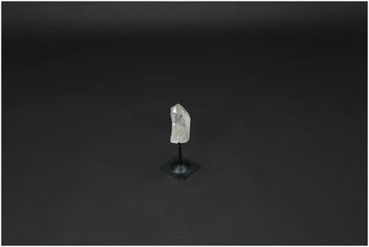 Lemurian Quartz crystal on metal stand, known as Master Healer, promotes clarity and balance in personal growth and well-being.