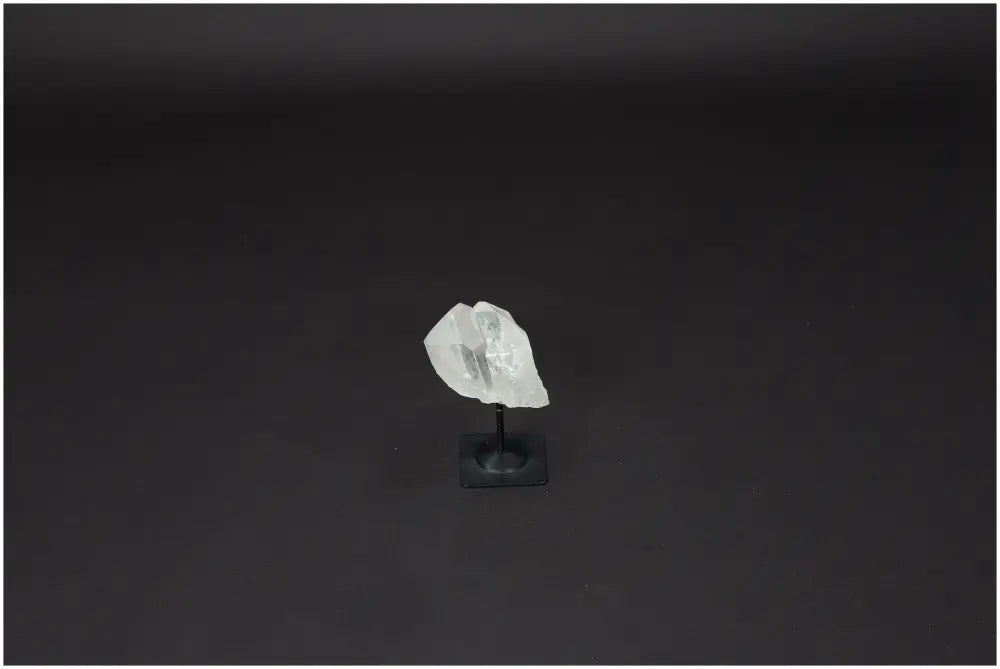 Lemurian Quartz on black metal stand for clarity and balance, hand-selected and ethically sourced crystal for personal growth.