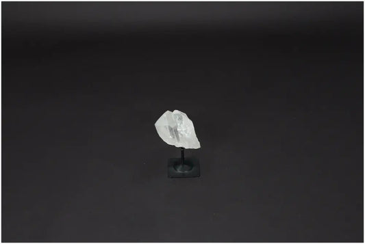 Lemurian Quartz on black metal stand for clarity and balance, hand-selected and ethically sourced crystal for personal growth.