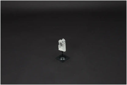 Lemurian Quartz crystal on metal stand against dark background, symbolizing clarity, balance, and personal growth.