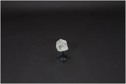 Lemurian Quartz on metal stand against black background, showcasing its clarity and natural beauty, perfect for crystal healing.