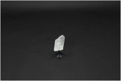 Lemurian Quartz crystal on metal stand, known as the Master Healer, enhances clarity, balance, and personal growth.
