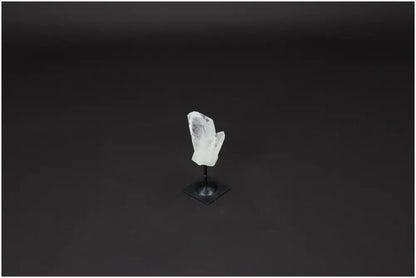 Lemurian Quartz on metal stand against dark background, known for purification and neutralizing negative energies, ideal for daily use.