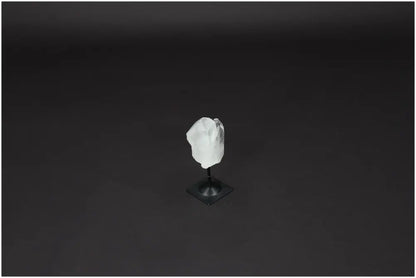 Lemurian Clear Quartz stone on a metal stand, ideal for energy purification and harmonizing space, against a dark background.