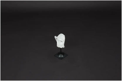 Lemurian Quartz on metal stand against dark background, a crystal known for purification, harmonizing energy, and neutralizing radiation.