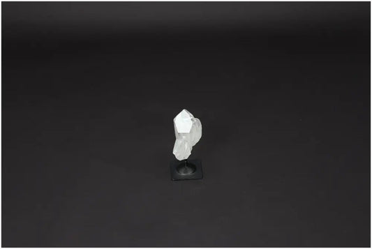 Lemurian Quartz crystal on a metal stand, offering clarity and balance as a master healer in personal growth and well-being.