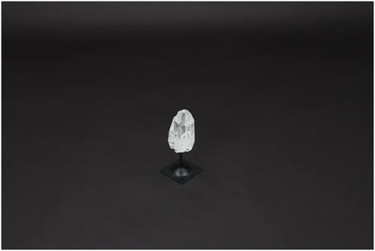 Lemurian Quartz on black metal stand, a powerful purification stone for harmonizing energy and neutralizing negative vibrations.