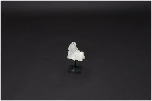 Lemurian Quartz on a metal stand, featuring clear quartz known for purification, harmonizing energy, and neutralizing negativity.
