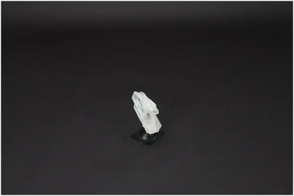 Lemurian Quartz on metal stand against dark background; a powerful purification stone that neutralizes negative vibrations.