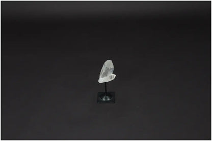 Lemurian Quartz on metal stand, showcasing its clarity and energy purification properties against a plain background.