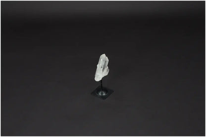 Lemurian Quartz crystal on a sleek metal stand, enhancing energy harmonization and space purification.