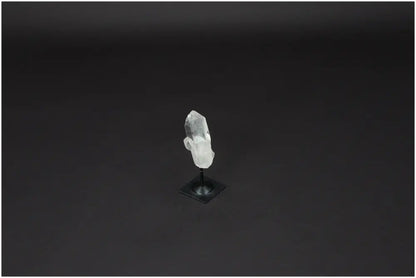 Lemurian Quartz crystal on sleek metal stand, ideal for energy cleansing and harmonization.
