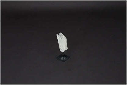 Lemurian Quartz on metal stand against dark background, known for purification and neutralizing negative energy. Ideal for daily use.