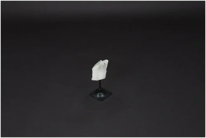 Lemurian Quartz on a sleek metal stand against a dark background, ideal for harmonizing and purifying space with powerful energy.