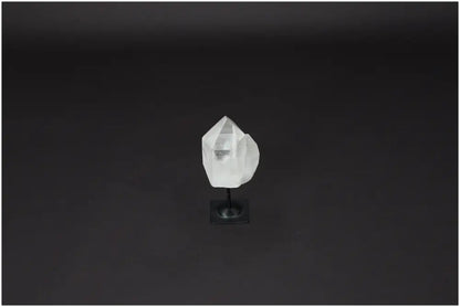 Lemurian Quartz crystal on metal stand against a dark background, ideal for purification, harmonizing energy, and absorbing negative vibrations.