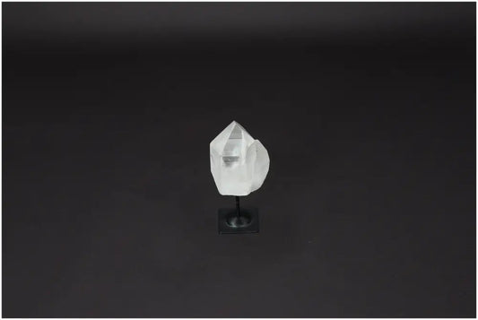 Lemurian Quartz crystal on metal stand against a dark background, ideal for purification, harmonizing energy, and absorbing negative vibrations.