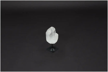 Lemurian Quartz crystal on metal stand, known for its powerful purification and negative vibration neutralization properties.