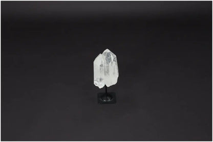 Lemurian Quartz on black metal stand for purification, absorbing negative energy, and cleansing spaces from harmful radiation.