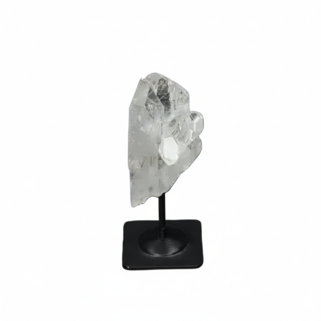 Lemurian Clear Quartz on a metal stand against a dark background, known for purification and neutralizing negative energy.