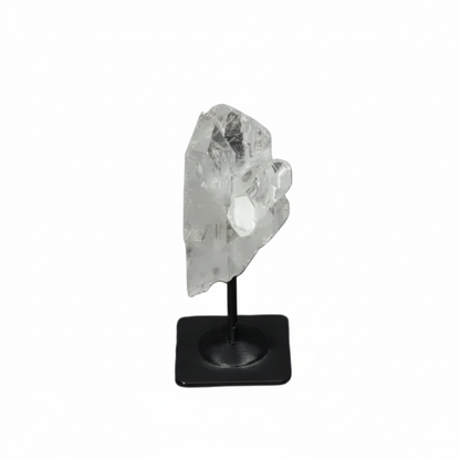 Lemurian Clear Quartz on a metal stand against a dark background, known for purification and neutralizing negative energy.