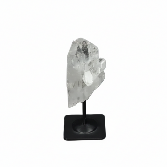 Lemurian Clear Quartz on a metal stand against a dark background, known for purification and neutralizing negative energy.