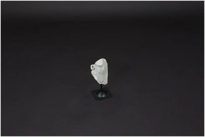 Lemurian Quartz on metal stand against dark backdrop, showcasing clarity and elegance, ideal for energy purification.
