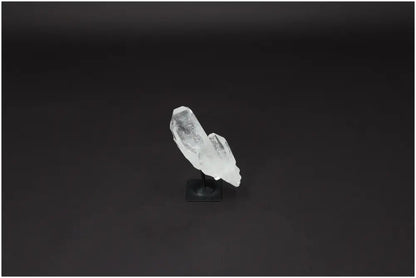 Lemurian Quartz Crystal on metal stand, showcasing its clear natural structure and ideal for harmonizing and purifying space.