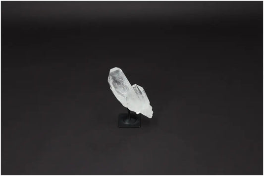 Lemurian Quartz Crystal on metal stand, showcasing its clear natural structure and ideal for harmonizing and purifying space.