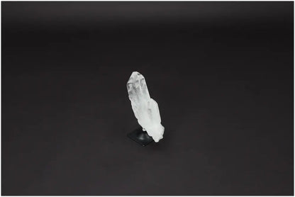 Lemurian Quartz crystal on metal stand offering powerful purification and harmonization of body, mind, and energy.