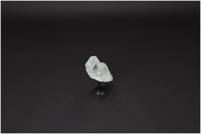 Lemurian Quartz Crystal on a sleek metal stand, ideal for purification and harmonizing energy by absorbing negative vibrations.