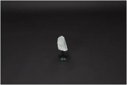 Lemurian Quartz on metal stand against dark background, ideal for energy purification and space cleansing.