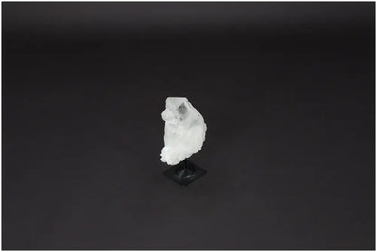 Lemurian Quartz crystal on metal stand, known for purification, harmonizing body and energy, absorbing negative vibes and radiation.