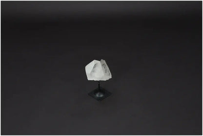 Lemurian Quartz on metal stand for energy purification and electromagnetic neutralization, ideal for home and office decor.