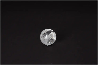 Lemurian Quartz Sphere 3-4 CM displaying radiant energy and spiritual growth properties on a dark background.