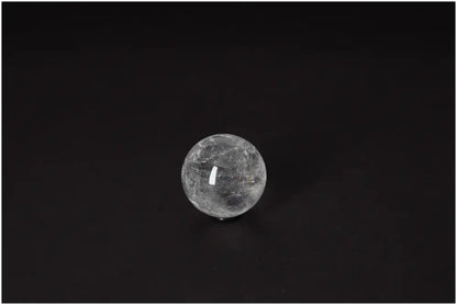 Lemurian Quartz Sphere 4-5 CM on black background, embodying ancient wisdom and radiant energy for spiritual growth and clarity.