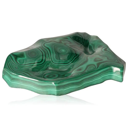 Polished malachite gemstone with mesmerizing green swirls, embodying tranquility and positivity.