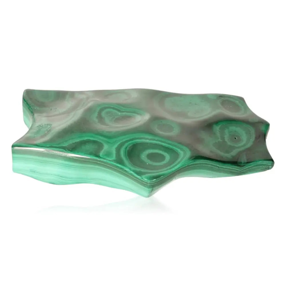 Malachite stone with swirling green patterns, embodying transformation and soothing energy