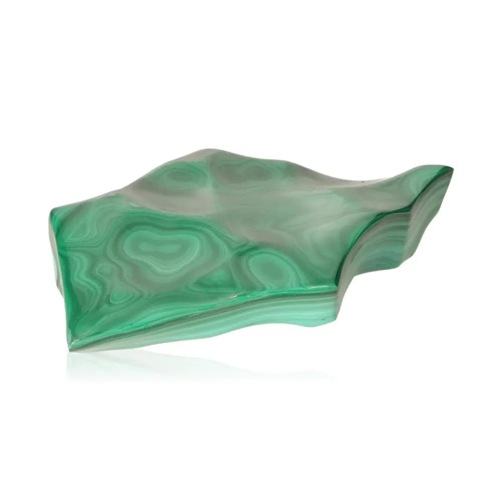 Polished malachite gemstone with swirling green patterns, symbolizing transformation and soothing energy.