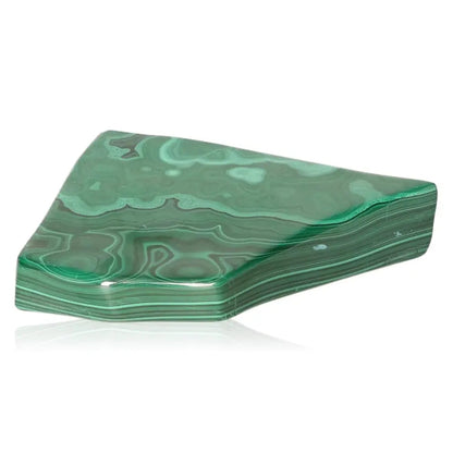 Polished green malachite stone with unique banding patterns, symbolizing courage and hope