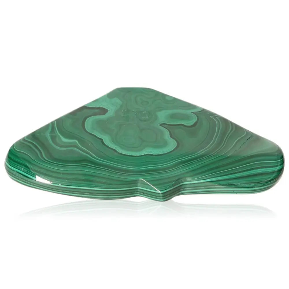 Polished malachite stone showcasing vibrant green bands and unique patterns, a symbol of nature's soothing energy and balance.