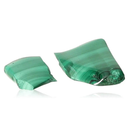 Two polished pieces of green malachite stone, known for soothing energy and promoting courage and inner harmony.