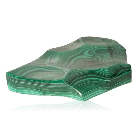 Malachite gemstone showcasing lush green hues and intricate patterns, known for its calming and energizing properties.