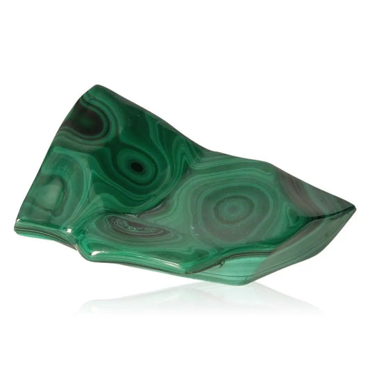 Malachite stone displaying rich green hues and distinctive swirling patterns, symbolizing serenity, courage, and positive energy.