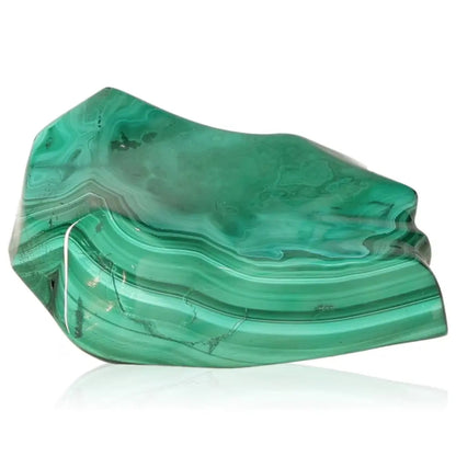 Malachite gemstone radiating natural tranquility and soothing energy, known as a beacon of hope and courage for life transitions.