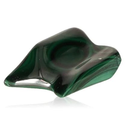Malachite gemstone displaying its deep green color and smooth, polished surface, symbolizing nature’s tranquil energy.