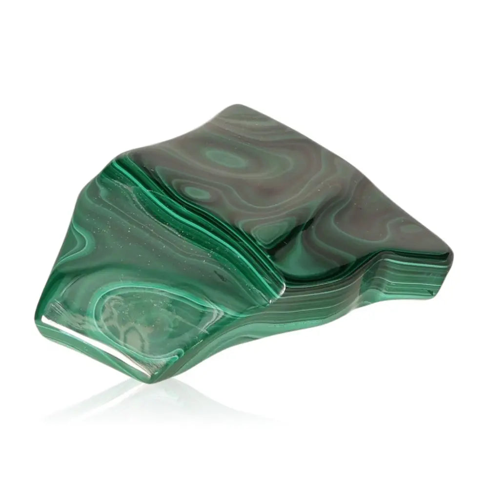 Vibrant green malachite stone showcasing its natural patterns and calming energy, perfect for courage and transformation.