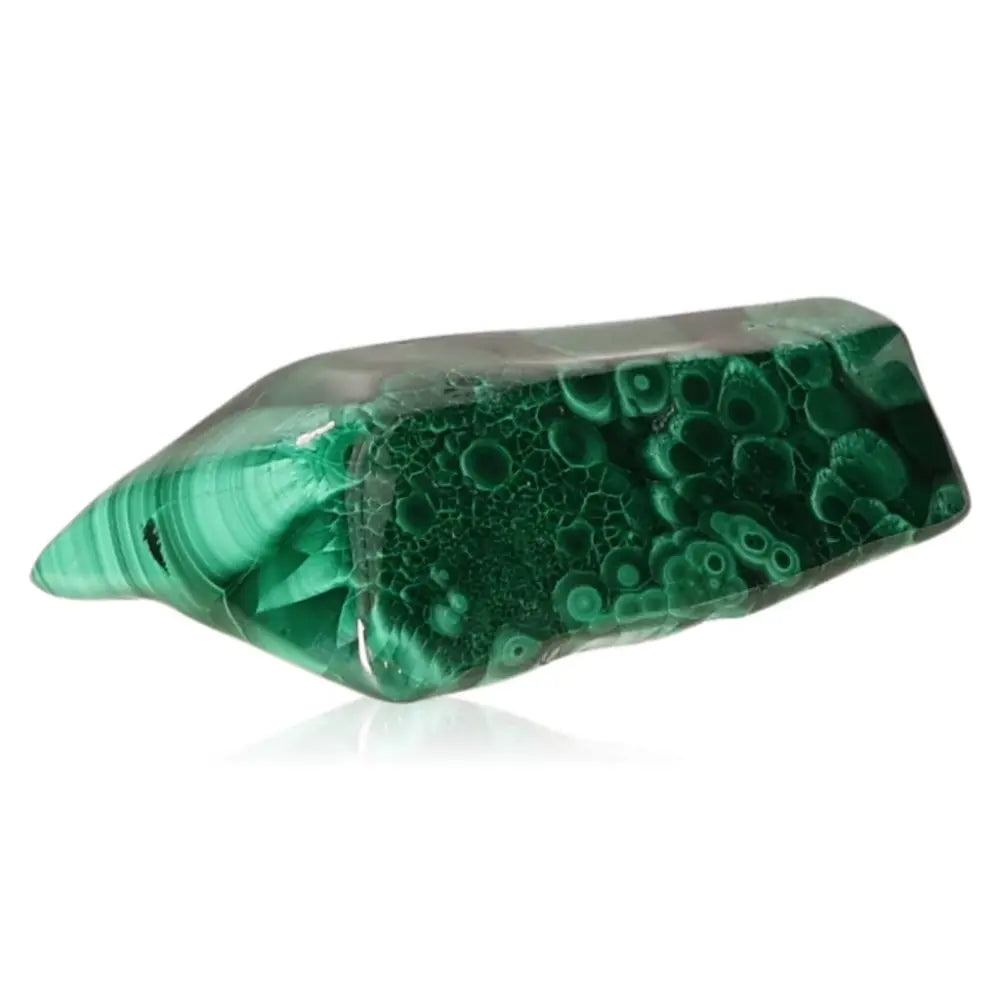 Vibrant green malachite gemstone showcasing unique patterns and textures, symbolizing nature's soothing energy and transformative power.