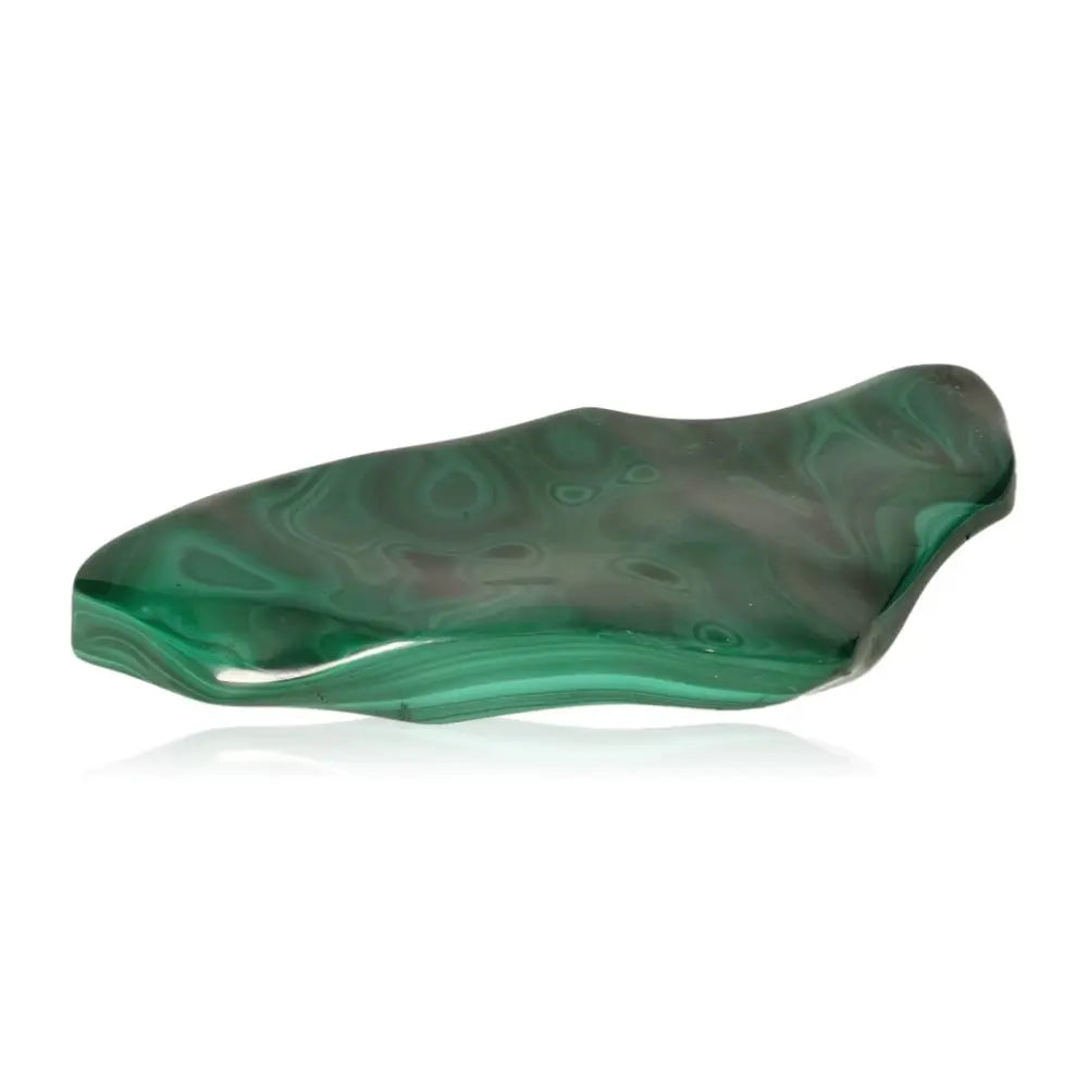 Polished malachite stone with mesmerizing green patterns, known for transformation and uplifting energy.
