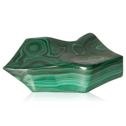 Malachite stone with vibrant bands of green, showcasing its natural beauty and healing properties, perfect for transforming living spaces.